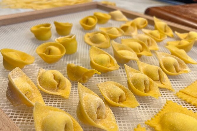 Rome Pasta Making Class with Italian Sauces and Wine Included - Rolling dough and shaping three pastas