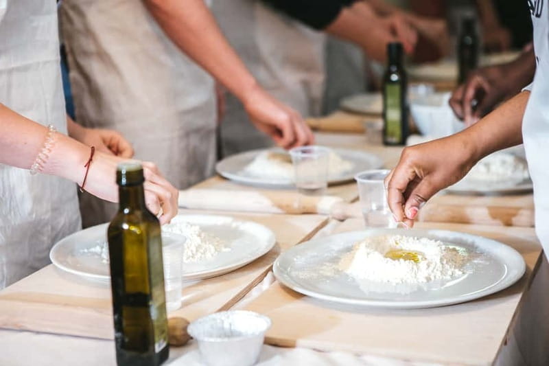 Rome: Pizza & Gelato Making Class with Wine & Limoncello - Sitting down for pizza, dessert, wine, and limoncello