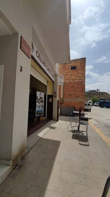 Salou: Priorat tasting Wine-Cellar Tour with hotel pickup - Siurana views, church stone, and reservoir scenery