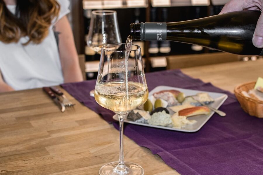 Salzburg: Guided Wine Tasting in a Hidden Wine Bar - Entering the shop and finding the wine bar