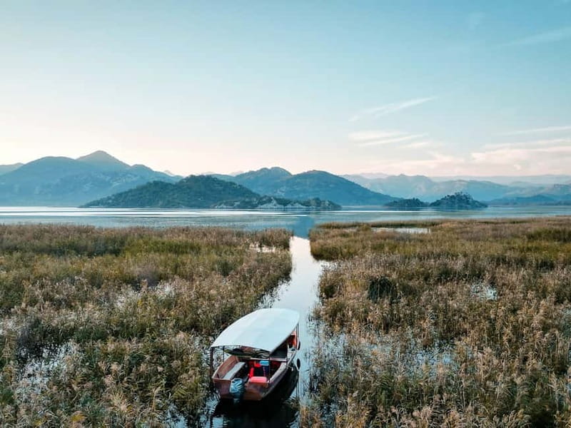 Skadar Lake: Guided Sunset Boat Tour with Wooden Boat & Wine - A soft-light cruise from Virpazar