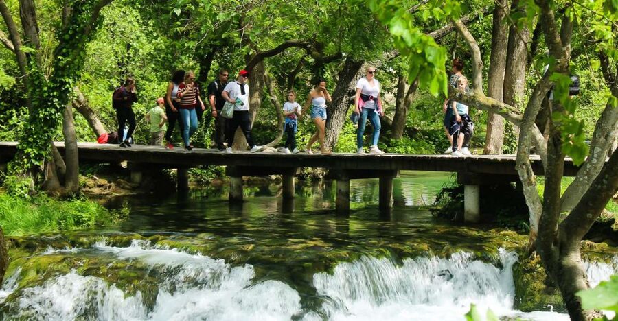 Split: Krka Waterfalls With Boat Cruise, Wine and Olive Oil - Skradinski buk and the wooden walkway