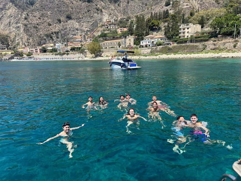 Taormina: Boat Tour with Sicilian Wine Tasting - The first coastal views and cave stops