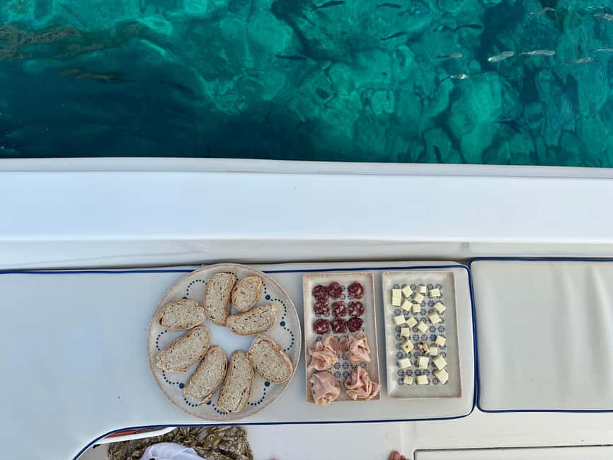Taormina: Boat Tour with Sicilian Wine Tasting - Blue Grotto and the rocky Ionian shoreline
