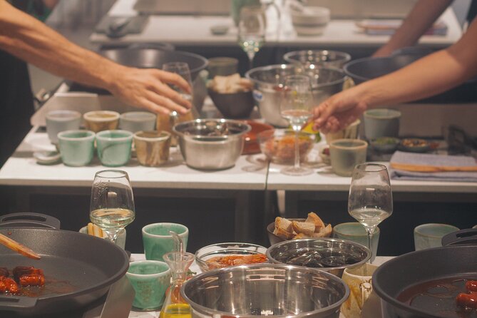 Taste of Spain: Tapas Cooking Class with Bottomless Wine Pairing - From cooking stations to a six-course dinner