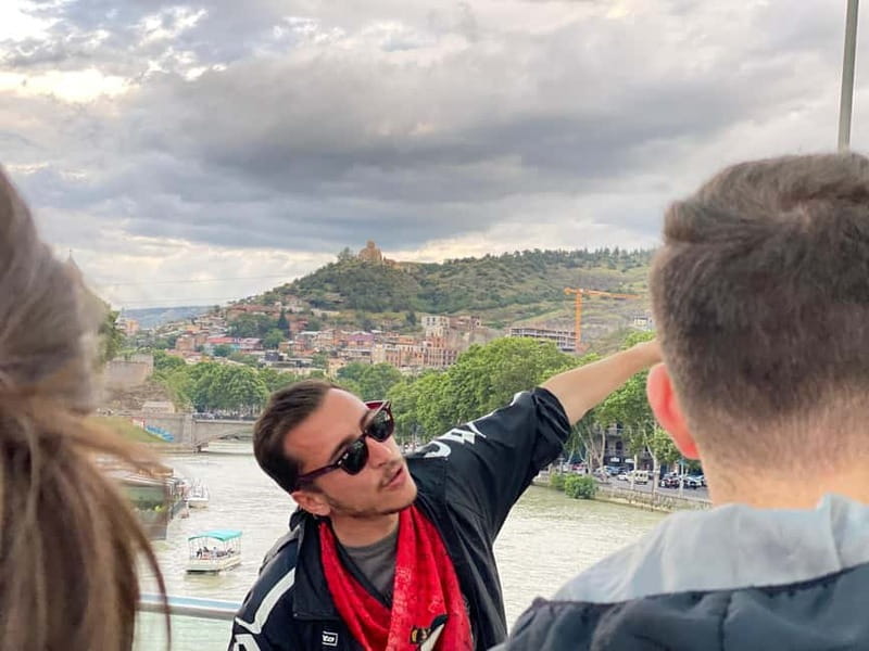 Tbilisi: Evening Walking Tour with Wine & Boat Ride Options - The Angel Clock Tower and Rezo Gabriadze’s playful design