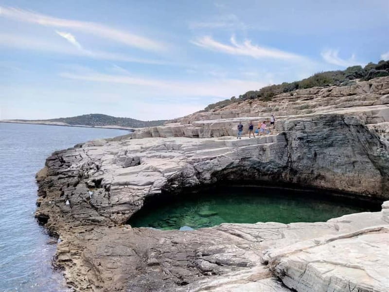 Thassos: Full-Day Cruise with BBQ, Wine, and Swim Stops - Passing the island’s rocky headlands