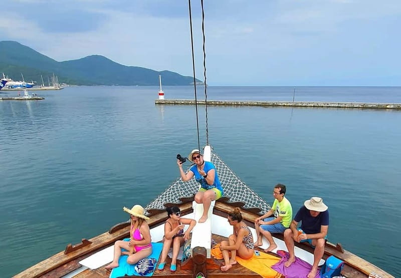 Thassos: Full-Day Cruise with BBQ, Wine, and Swim Stops - Pickup, road transfer, and getting aboard