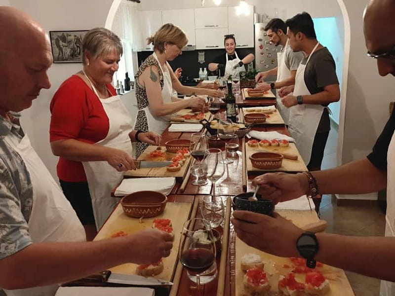 Tirana: Traditional Cooking Class with Wine & Raki Tasting - Homemade wine, raki, and the family table
