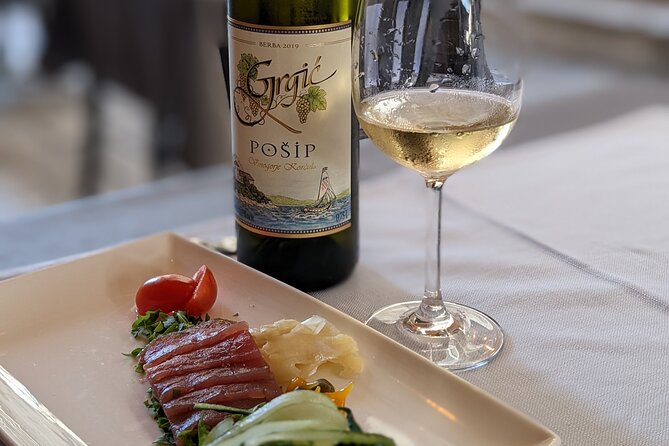 Wine, food and olive oil by PhD student - Dubrovnik’s Old Town, served with a wine glass