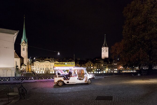 Zurich eTukTuk Private Tour - with Cheese Fondue and Wine - Limmatquai and the riverfront view